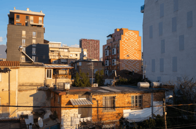 Tirana covered in mortar and construction sites, empty towers, skyrocketing