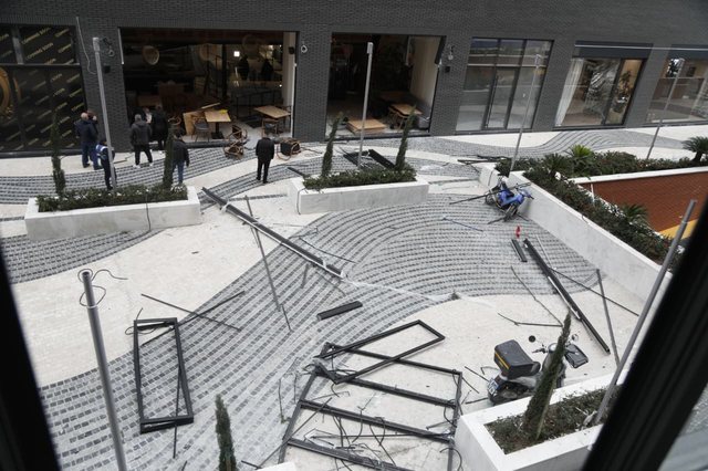 NAMES/ Broken windows and damaged structures, view from the business where the