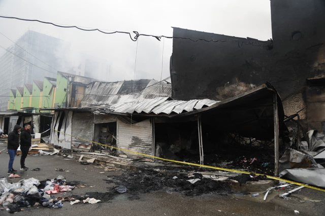 Completely burned shops and ruins, view from the "May 5" market after