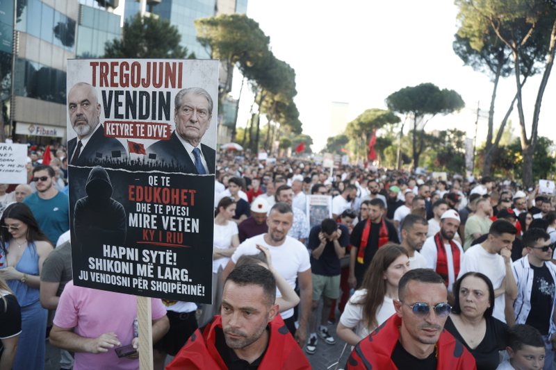 "Berisha in prison!" and Berisha trying to hijack the protest