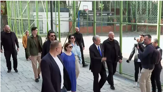 Accompanied by his family, Berisha votes at the "Kosova" school