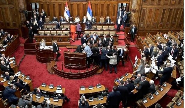 After chaos, half of Serbian parliamentarians return to session