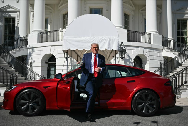 Donald Trump is buying Tesla to help Musk