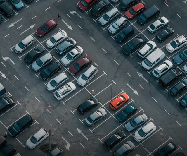 Why in Japan, those who arrive early for work park their cars in the most