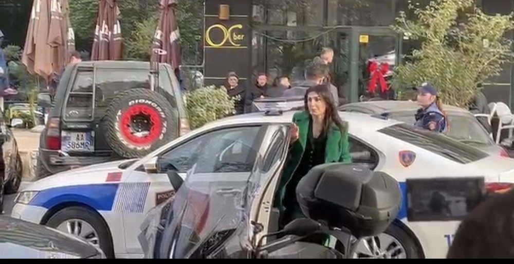 NAKSHI tenders/ Mirlinda Kar&ccedil;anaj at GJKKO with police car